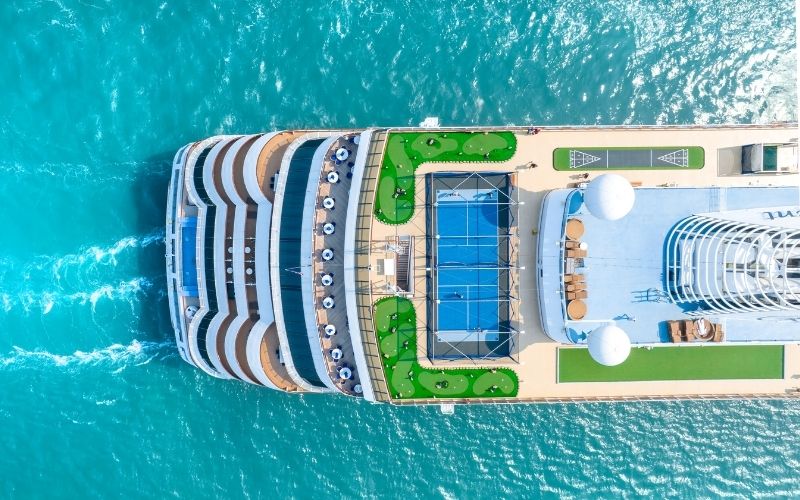Cruise ship departing San Diego harbor at sunset